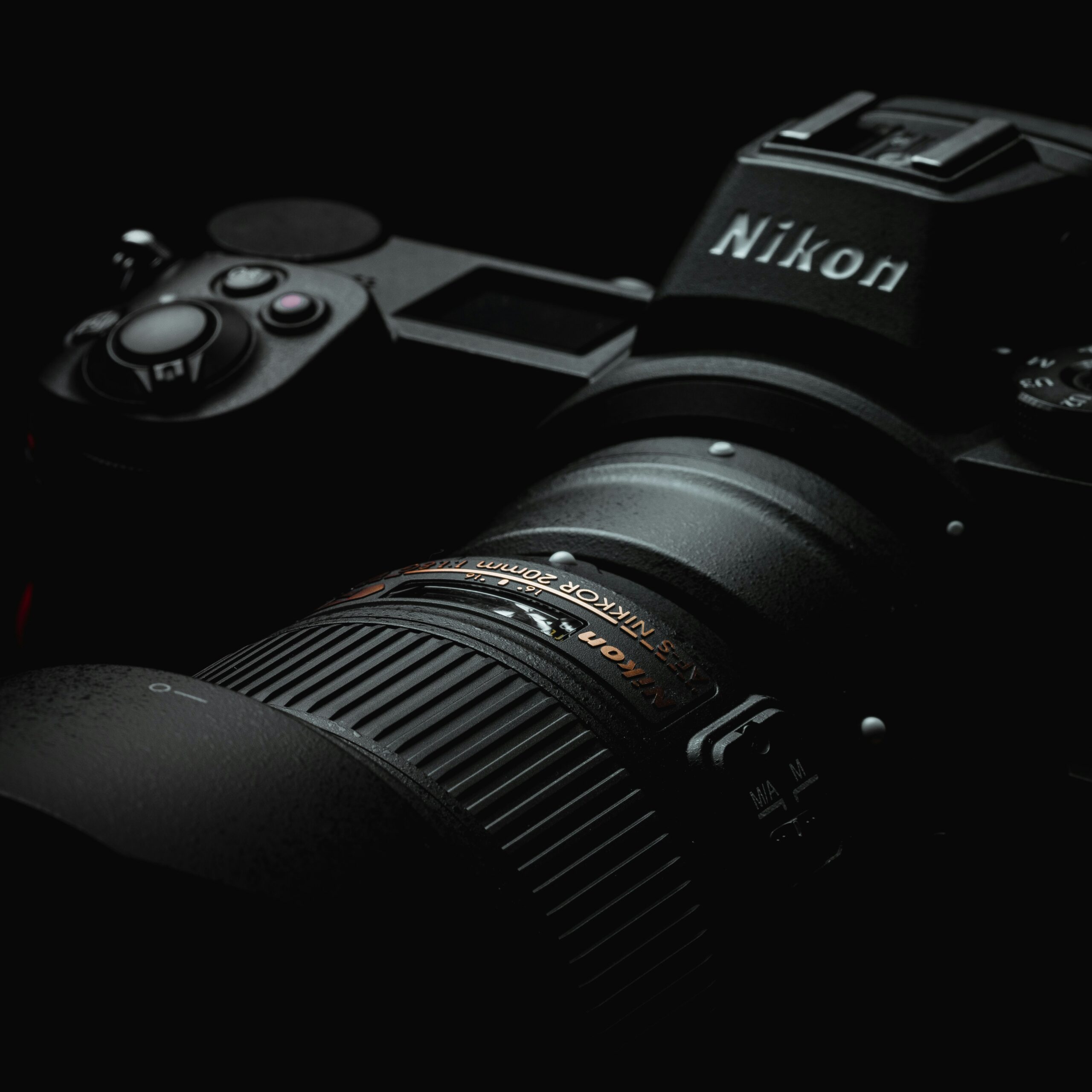 Close-up of a Nikon Z6 mirrorless camera, showcasing its sleek black body, detailed buttons, and electronic viewfinder