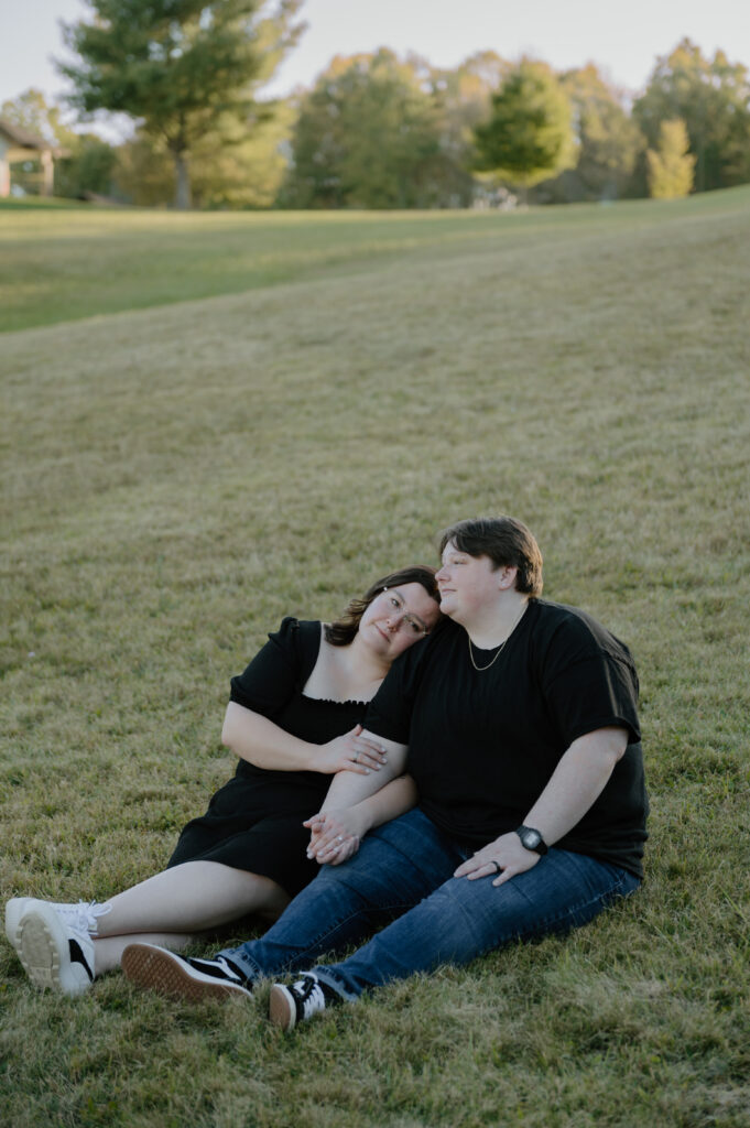 Couple embracing in front of rolling hills at Cuyahoga Valley National Park