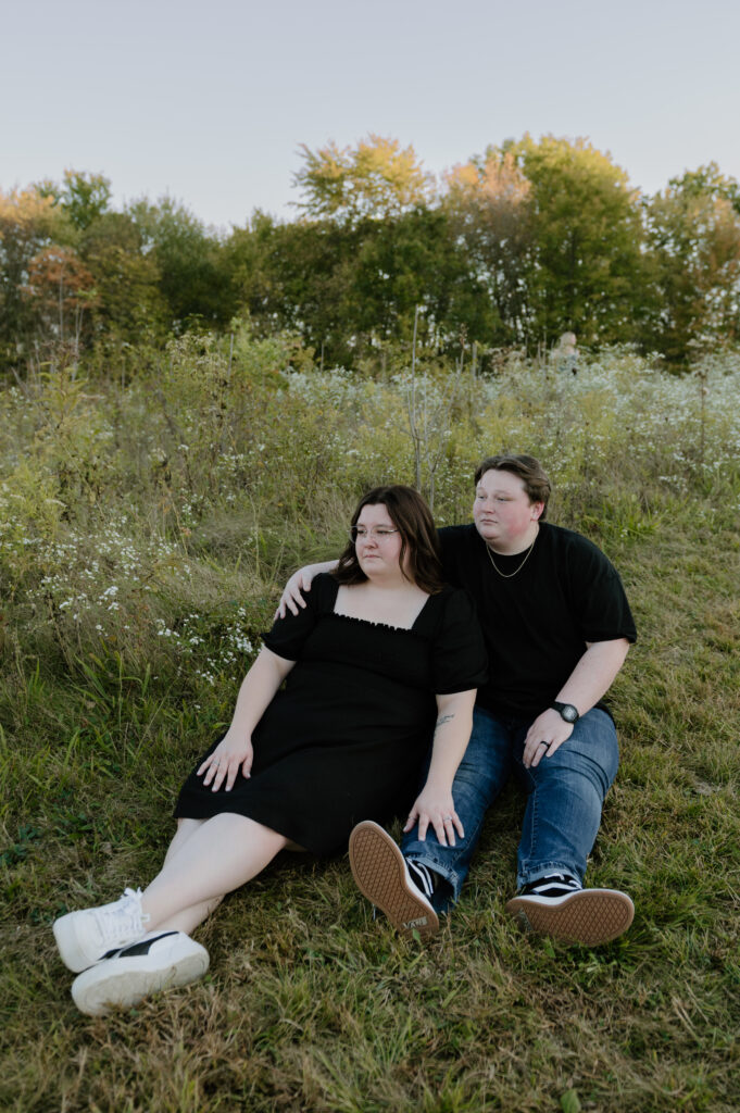 Couple embracing in front of rolling hills at Cuyahoga Valley National Park