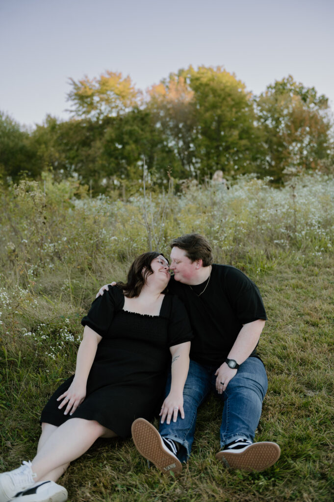 Couple embracing in front of rolling hills at Cuyahoga Valley National Park
